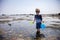 Boy exploring tide pools on New Hampshire coast