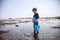 Boy exploring tide pools on New Hampshire coast