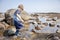 Boy exploring tide pools on New Hampshire coast