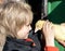 boy on a farm meets a baby gosling. Surprise, joy from communicating with little chicks