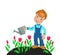 Boy farmer watering tulips