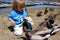 Boy feeding ducks