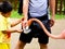 A boy feeding a flamingo