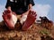 Boy feet front image at natural sky filed