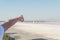 A boy finger shows on the salt lake in Larnaca.