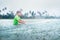 Boy first step surfer learning to surf under the rain