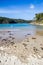 Boy fishing, beach by Pambula river estuary