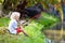 Boy fishing. Child with rod catching fish in river