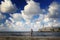 Boy fishing in front of lighthouse