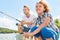 Boy is fishing together with his father