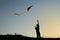 A boy flies a kite