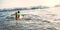 Boy floats on surf board