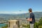 Boy flying a drone from Mount Bre above Lugano