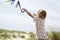 Boy Flying Kite On A Windy Beach