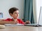 A boy focusing on study, writing on paper. homeschooling concept