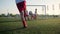 Boy footballer is kicking ball through wall of players
