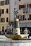 Boy fountain with a fish statue in Rovinj, Croatia