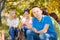 Boy and friends hold marshmallow sitting near tent