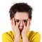 Boy with frightened look in white background