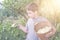 Boy with full herbs flower basket