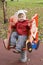 Boy in funny hat at children\'s playground