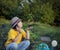 Boy in the garden admires the plant before planting. Green Sprout in Children Hands