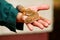 Boy with gecko. Man holds in hands reptile gecko. Common leopard reptile gecko pets. Exotic tropical cold-blooded animals, zoo.