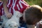 A boy getting a puppy kiss