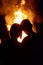 The boy and girl on the background of fire (love, relationships,