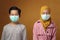 Boy and girl, brother and sister wearing medical mask to prevent covid coronavirus infection, social distancing