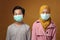 Boy and girl, brother and sister wearing medical mask to prevent covid coronavirus infection, social distancing the new normal