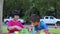 Boy and girl that built a toy tower with colorful, exciting blocks and slapped it while at the table in the Sarana Garden