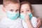 Boy and girl, a children in a medical mask. The concept of an epidemic, influenza, protection from disease, vaccination