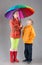 Boy and girl with a colorful umbrella