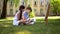 Boy and girl drawing outdoors.