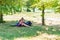 A boy and a girl are engaged in education and doing lessons in nature, preparing for entrance and final exams