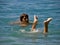 Boy and girl feet in the sea