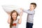 Boy and girl fighting pillow