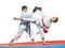 Boy and girl in karategi are training paired exercises karateBoy and girl in karategi are training paired exercises karate