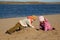 Boy and girl play sand on beach on river bank