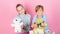 Boy and girl play with soft toys teddy bear on pink background. Bears toys collection. Teddy bears help children handle