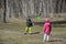 Boy with a girl playing in a clearing in the woods they throw th