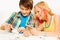 Boy and girl playing table game at home