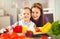 Boy and girl preparing and eating healthy meal at home