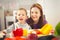 Boy and girl preparing and eating healthy meal at home