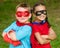 Boy and girl pretending to be superheroes