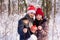 Boy and girl in red hats holding gift and bengals