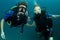 Boy and girl scuba dive together