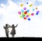 Boy and girl in silhouette graphic let a bunch of balloons go into the sky