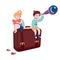 Boy and girl sitting on suitcase